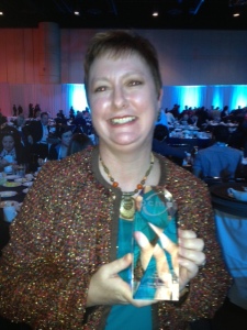 Difficult to see, but I am holding my lovely glass trophy-like award